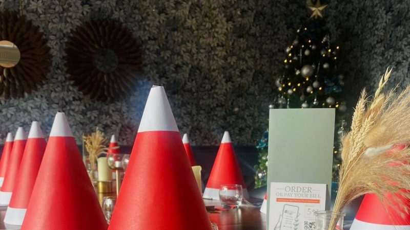 Christmas santa hat table decorations at The Bear and Ragged Staff pub.